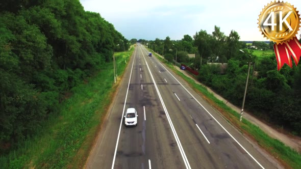 Aerial Footage of a Car Riding on a Road Between