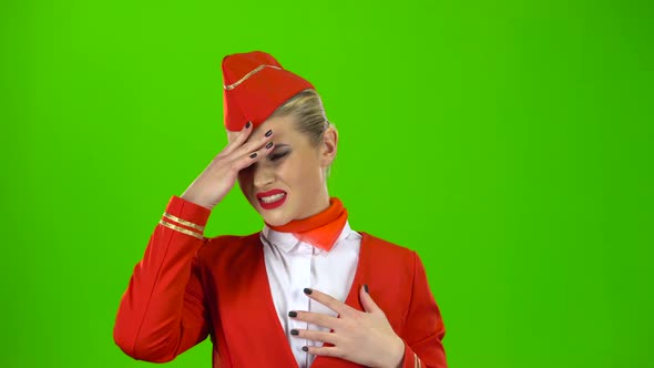 Girl Suffers From a Headache. Green Screen alt