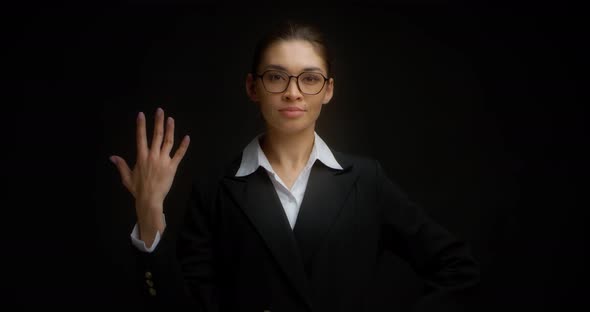 Business Woman with Glasses with a Serious Five Shows Fine Finger