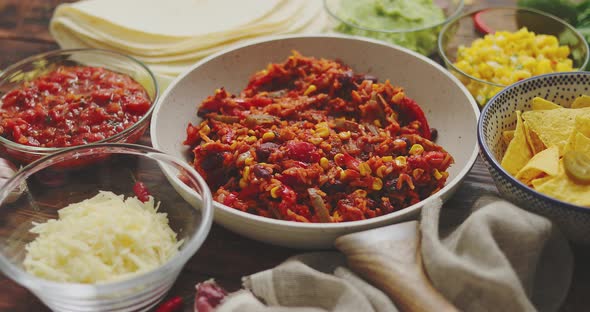 Mexican Food Concept. Vegetable Burritos. Served on Pan. Tortilla Guacamole, Salsa, Chilli and Beans alt