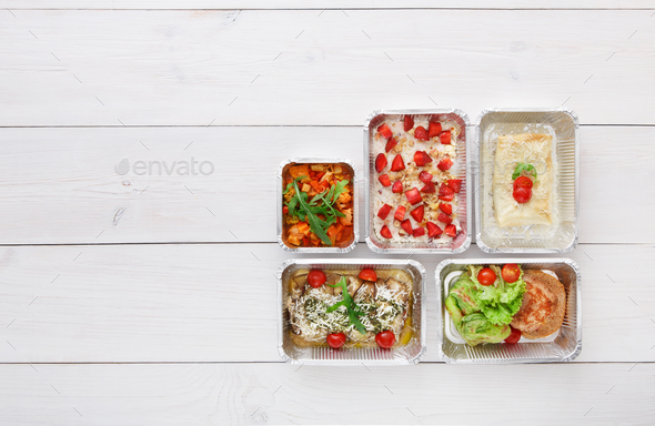 Healthy food take away in boxes, top view at wood - Stock Photo - Images
