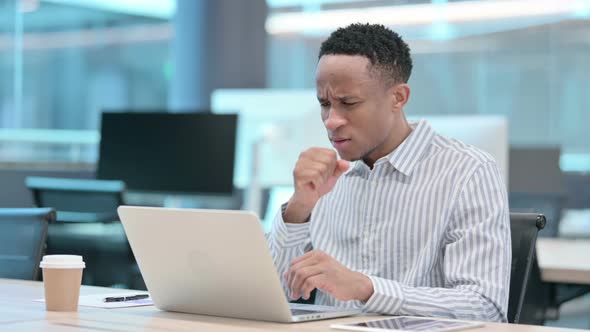 Young African Businessman with Laptop Having Cough Coughing alt