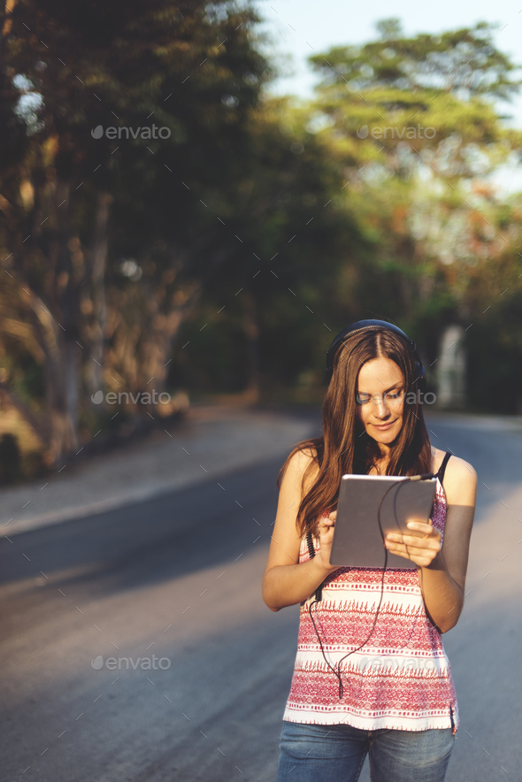 Woman Using Tablet Outdoors Concept