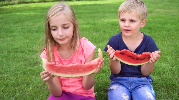 Kids Eating Watermelon Outdoors