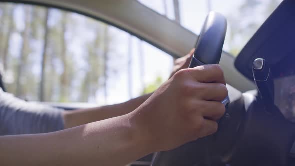 Close up video of driving a car on a sunny day. Shot with RED helium camera in 8K. alt