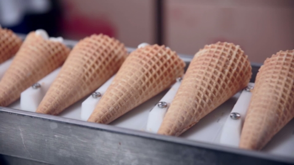 Modern Equipment At The Food Factory. Automatic Conveyer, Production Line Of Ice-cream Cones. alt
