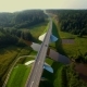 Aerial View Of Cars Going Over The Bridge In The Forest - VideoHive Item for Sale