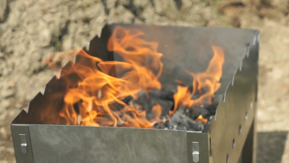 Flames With Sparks On The Coals In The Grill alt
