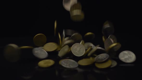 Big Pile Of Coins Fall On The Table And Flying Away In Different Directions 2