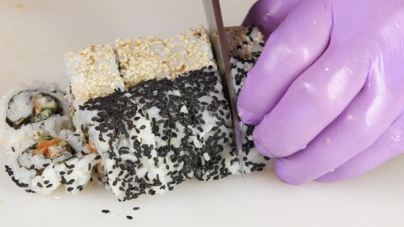 Master Prepares The Rolls Cut Pieces.  alt