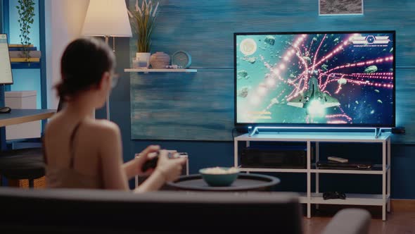 Caucasian Woman Losing While Playing Video Games Holding Modern Controller alt