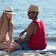 Pretty Woman Applying Sunscreen On Man's Shoulder - VideoHive Item for Sale