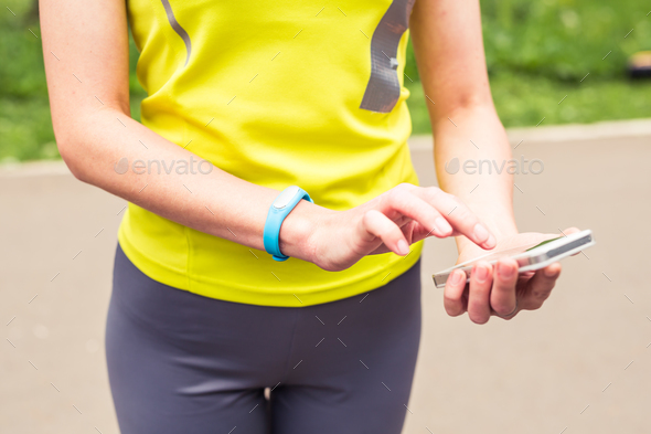 Hand wearing a fitness tracking armband