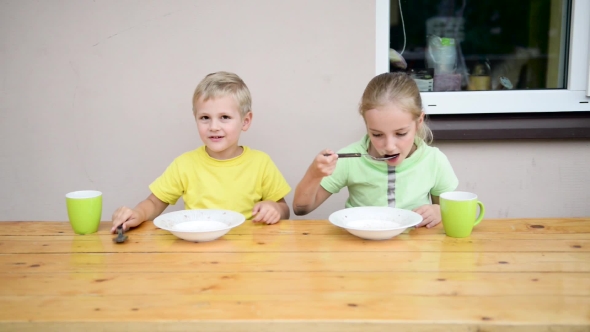 Two Cute Kid Eating