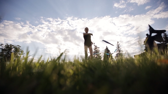 Dance Young Gymnast With Ribbon On Sunset Sky Background. Rhythmic Gymnastics. alt
