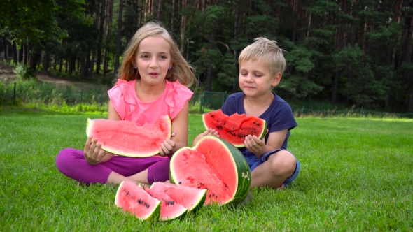 Kids Eating Watermelon Outdoors