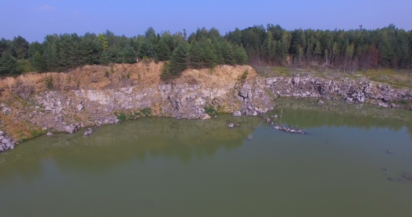Flooded Stone Quarry In The Woods Of Eastern Europe
