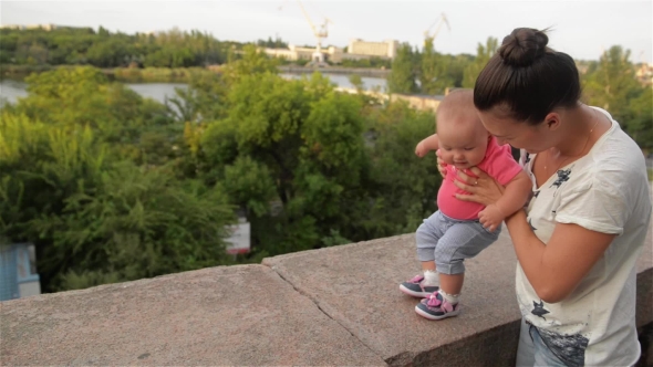 Little Girl Learning To Walk With His Mother, First Steps, Park, Sunny Day alt