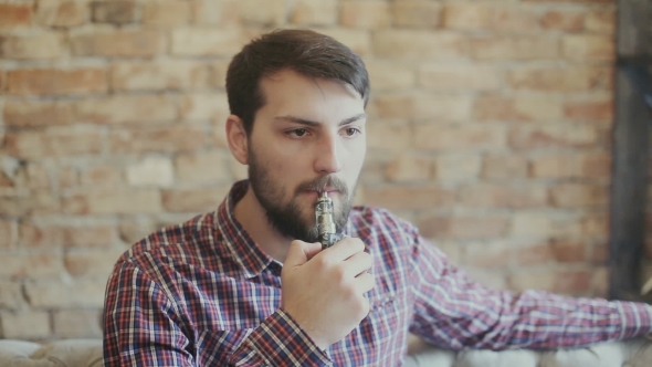 Man Smoking Electronic Cigarette Vapor alt