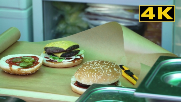 Chef Finishes Cooking Burgers 4