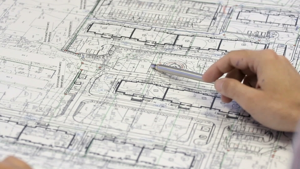 Male Architect Checking Blueprints House Construction Planning.