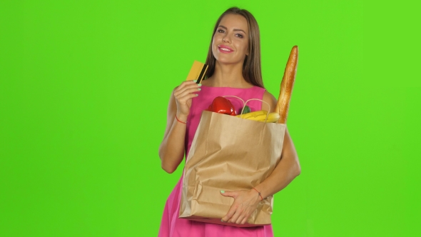 Girl Pressed The Card And Package To Himself And Smiles alt