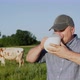 A Farmer Drinks Milk From a Jug - VideoHive Item for Sale