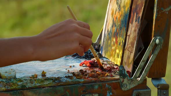 Unknown Artist Mixing Paints on Palette alt