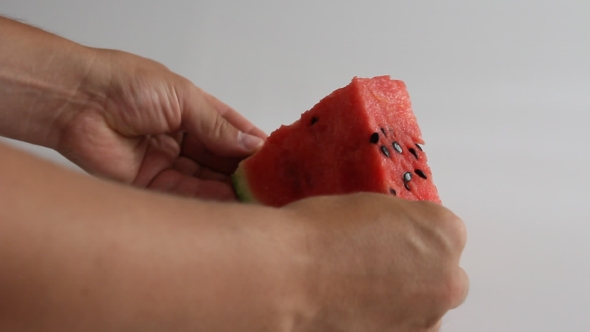 Watermelon Slices Laid Out On a White Background. alt
