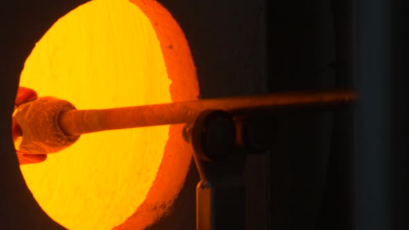Glass Blower Uses an Small Industrial Furnace