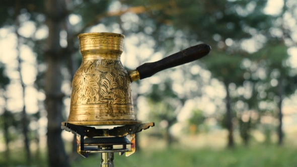 Turkish Coffee Cooked On a Gas Stove alt