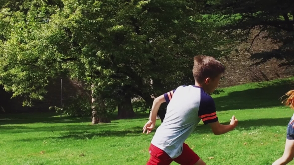 Happy Kids Running And Playing Tag Game Outdoors 30 alt