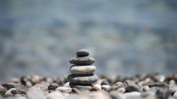 Pebble Tower Against Blue Sea