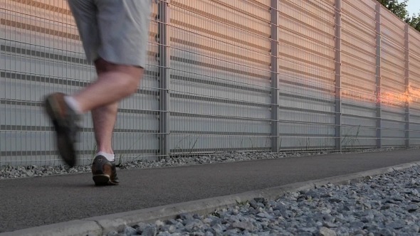 Running Shoes Of Runner Feet Running On Road With  On Shoe.  alt