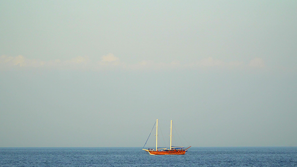 The Yacht With Sails Lowered Sails on the Sea