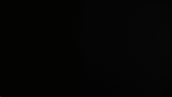 Hands Using a Film Clapper Board, On Black,  alt