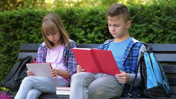 Boy And Girl Reading Book