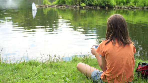 Girl With Remote Controlled Boat