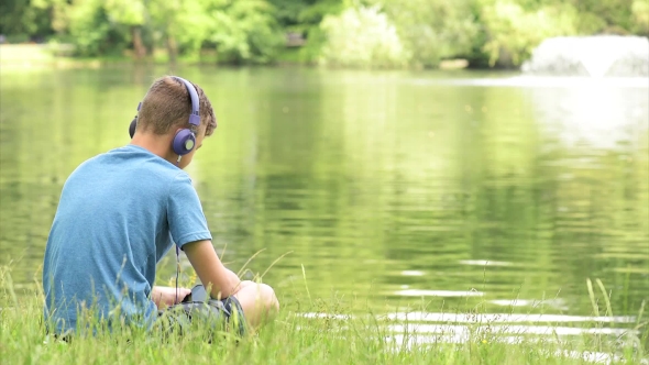 Teen Boy At Lakeside