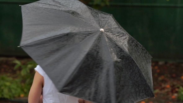 Woman With Umbrella In The Rain