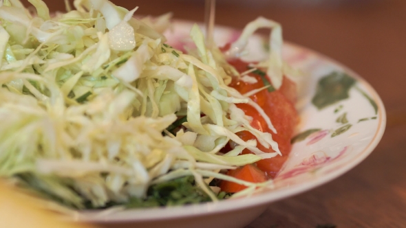 Oil Poured Into Salad