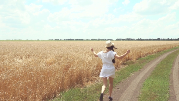 Woman In a White Dress Runs Across The Road