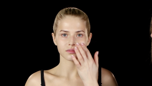 Professional Makeup Artist Makes a Girl Natural Makeup. Black.  alt