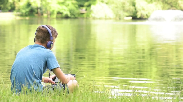 Teen Boy At Lakeside