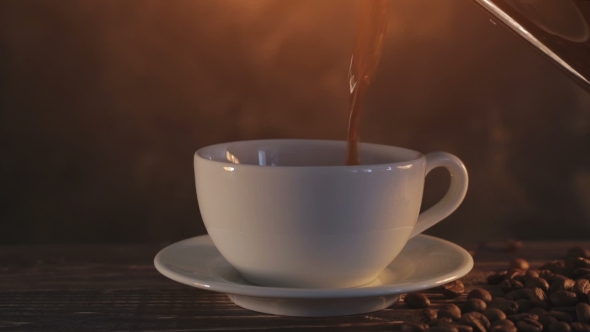 Steaming Coffee On Dark Brown Background