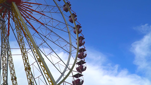 Bottom View Onto a Rotating Ferris Wheel
