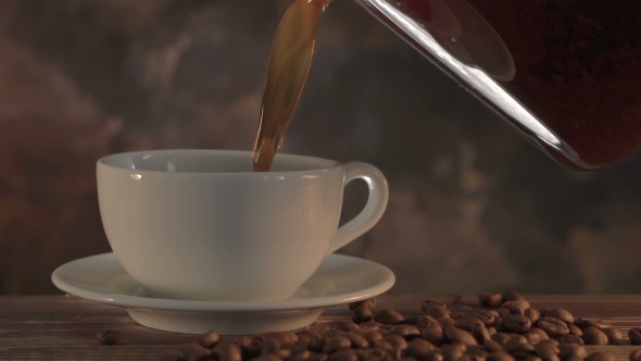 Steaming Coffee On Dark Brown Background