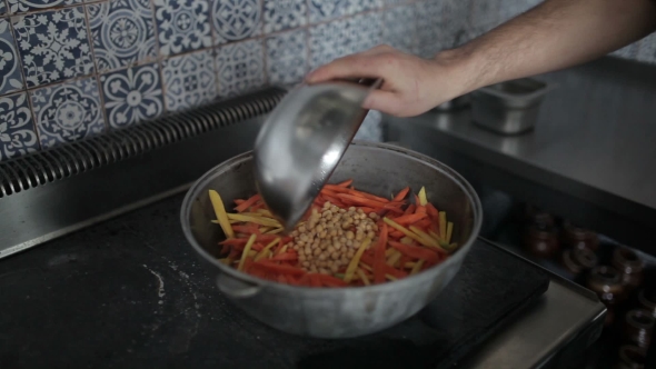 Beans Are Added To The Vegetables Pot. alt