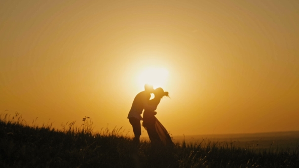 Romantic Silhouette Of Man On High Hill - At Sunset - Kissing And ...