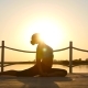 Slim Woman Doing Yoga Over Orange Sun - VideoHive Item for Sale